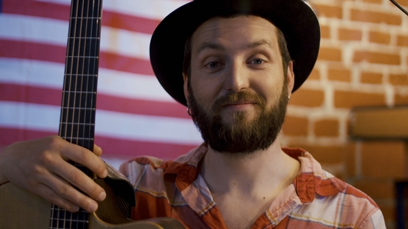 Bearded Hipster Musician with Guitar