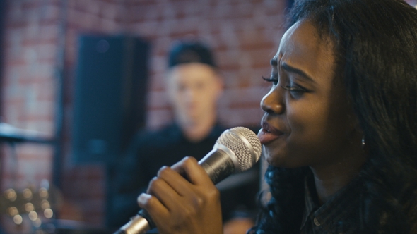 Beautiful Black Woman Singing with Feelings