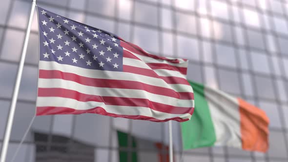 Waving Flags of the USA and Ireland in Front of a Building alt