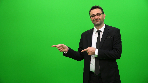 Businessman Presenting in Front of a Green Screen