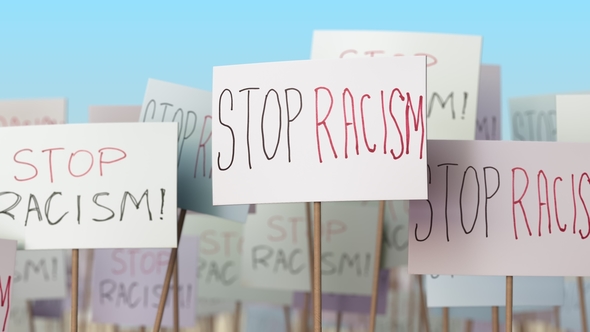 STOP RACISM Placards at Street Demonstration