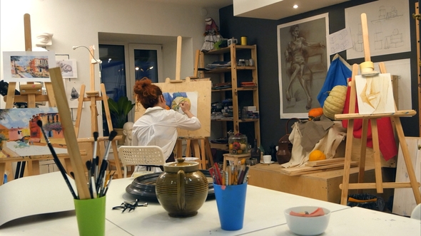 Ginger Female Artist Painting Still Life in Art Studio