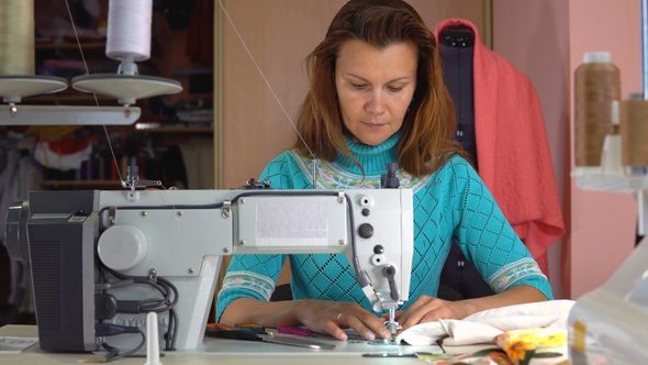 Woman Tailor Working in Dressmaking Studio.