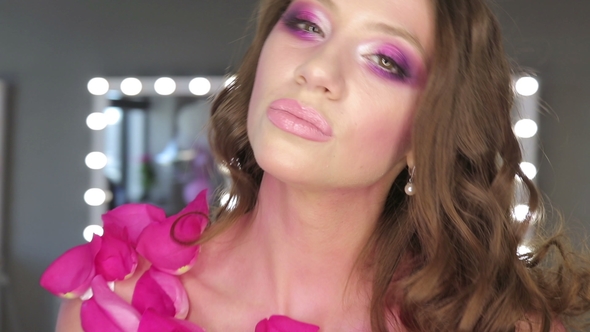 Charming Young Woman with Pink Make-up