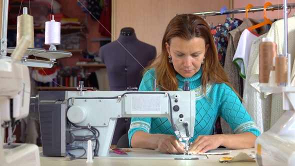 Woman Tailor Working in Dressmaking Studio