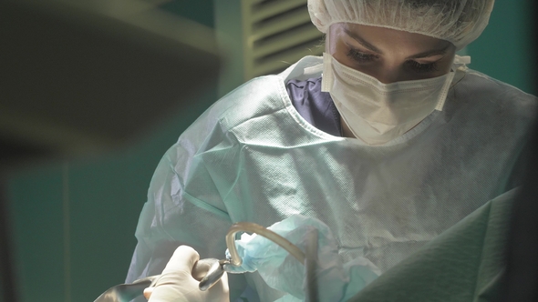 Surgical Team Are Performing Surgery on Breasts in Hospital Operating Room