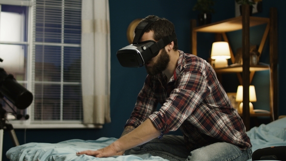Man Exploring Virtual Reality in Goggles