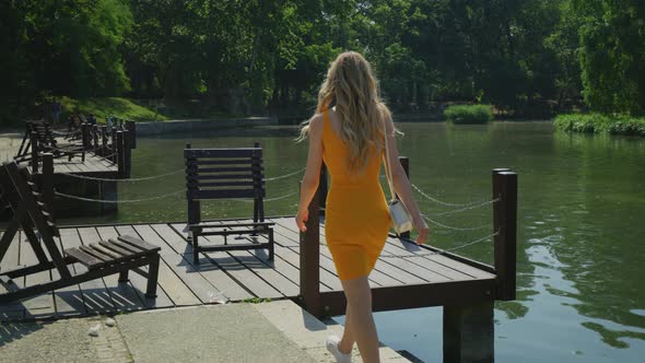 Woman walking on a wooden dock