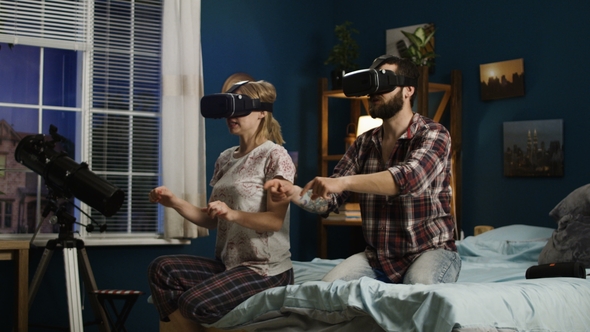 Couple in VR Glasses Having Fun on Bed