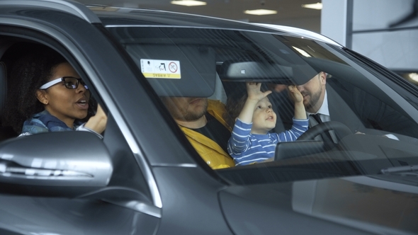 Diverse Couple Exploring New Car