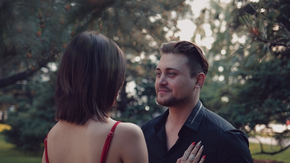 Young and Loving Couple in a Summer Park