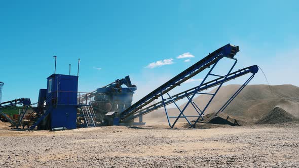 Cracking Vehicles Are Working at the Mining Site. Mining Excavation Equipment.