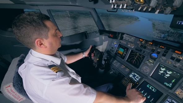 Demonstration Flight Is Being Performed By a Male Instructor in a Flight Simulator