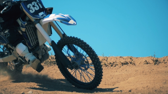 Clouds of Dust Are Getting Raised After a Motorcycle Driving Through Terrain