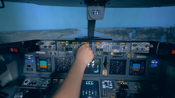 Flight Instructor and His Trainee Are Practicing Taking Off in a Flight Simulator