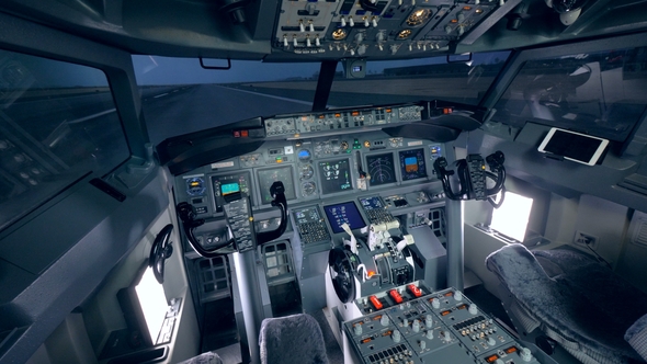 Detailed Footage of a Cockpit of a Plane Which Is Standing on a Take-off Runway