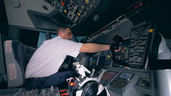 Flight Instructor Is Checking Readiness of the Equipment in the Flight Simulator Before Launching