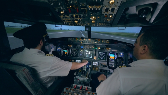 Professional Pilot Is Giving Instructions To an Amateur While Taking Off in a Flight Simulator