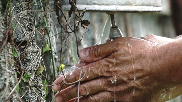 Man Washing Hands Using Old Washstand Outdoors. .