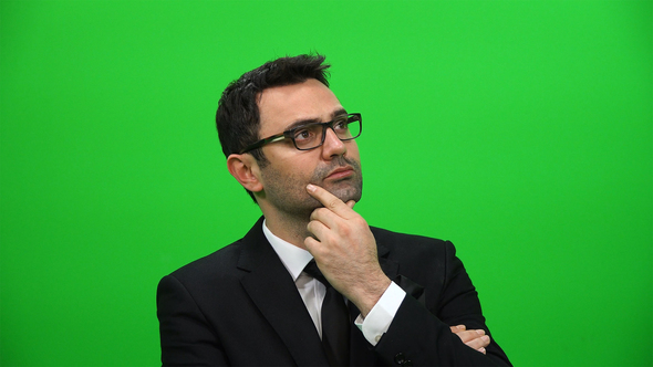 Serious Man Looking Sideways on Green Screen Background