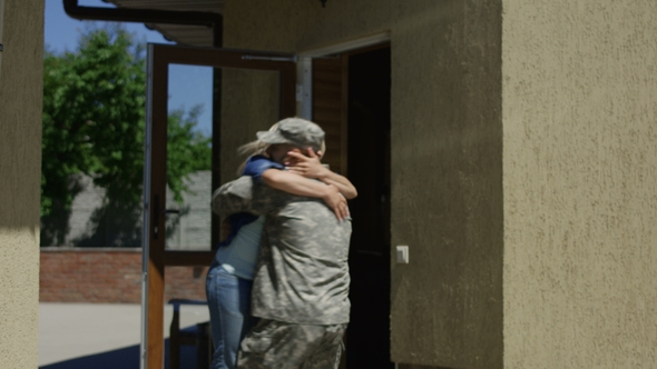 Loving Wife Meeting Soldier at Home