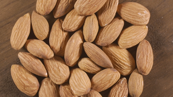 Almond Rotating on a White Plate