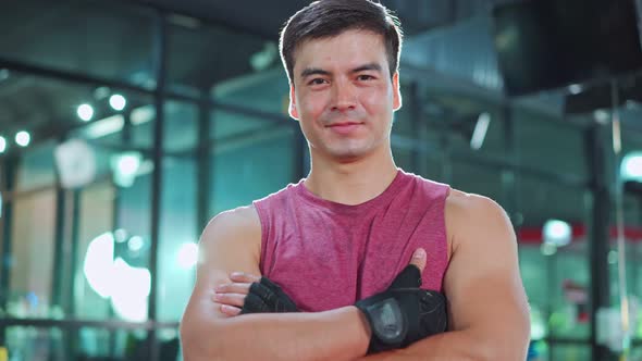 Portrait of Active Caucasian handsome Fitness sportman trainer workout exercise in stadium or gym.