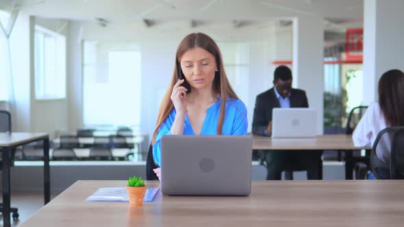 Successful Manager Ring Up Clients in Open Space Office Worker in Start Up Company