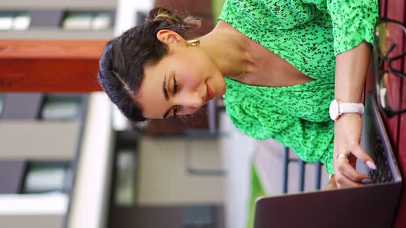 Caucasian Woman Working with Laptop Computer Outside Office