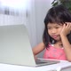 Funny Asian child learning class study online with a video calls from a notebook - VideoHive Item for Sale