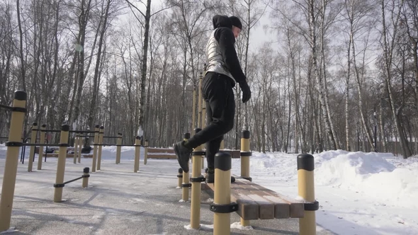 Fitness Man Jumping on Bench During Workout Training on Sport Ground