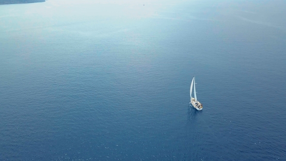 Yacht Sailing on Opened Sea. Sailing Boat. Yacht From Drone