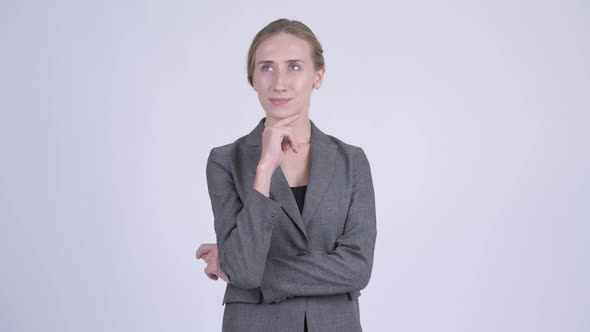 Happy Young Beautiful Blonde Businesswoman Thinking