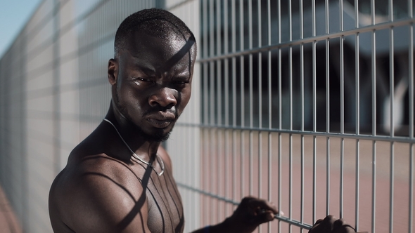 Confident and Angry African American Man Looking at Camera - Outdoor. Drug Trafficker, Prisoner