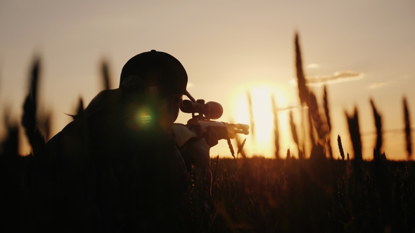 A Sniper Rifles From a Rifle with an Optical Sight. On the Sunset. Sports Shooting and Hunting