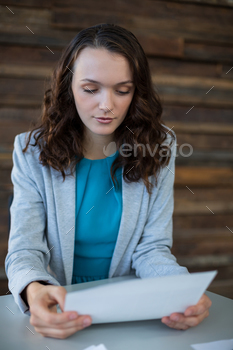 Female graphic designer looking at photos