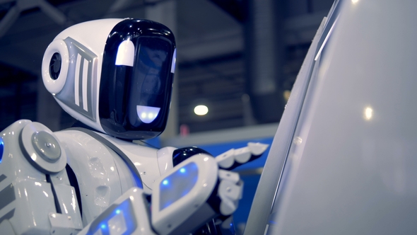Cheerful Cyborg Is Poking Touchscreen During Working Process