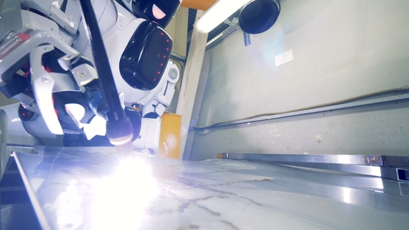 Metal Sheet Getting Welded By a Industrial Robot