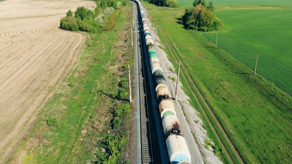 A Long Train Set Goes on a Railway Top View Aerial View of Train at Sunset