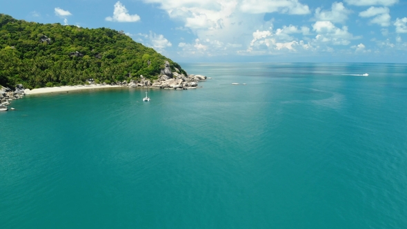 Flying Over Amazing White Sand Beach and Tropical Lagoon with Yacht