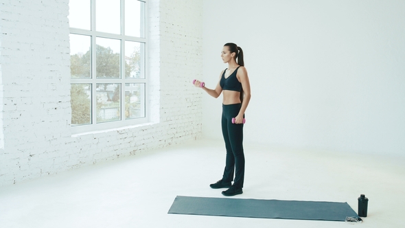 Beautiful Girl Wearing Sport at Background Near Big Windows