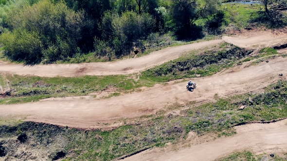 Motorcycle Is Moving Across a Track with a Rider on It