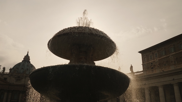 The Famous Fountain of San Pietro Italian Square with Saint Peter Church Columns, in Rome, Italy.