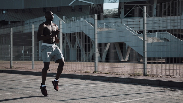 African American Athlete Man Warm Up Running on the Spot Outside. Sport Workout Motivation Healthy