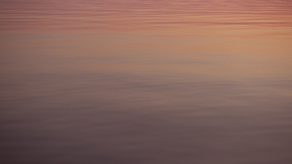 Skipping Stone, Beautiful Sunset Reflect on Water Surface