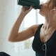 Pretty Girl In Gym Wearing Sport Wear Listening The Music And Drinking Water - VideoHive Item for Sale