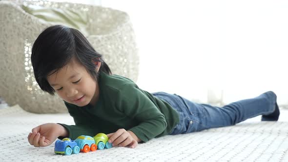 Cute Asian Child Playing Toy Cars Slow Motion