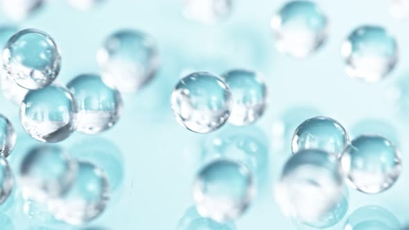 Super Slow Motion Shot of Hydrogel Balls Bouncing on Glass at 1000Fps