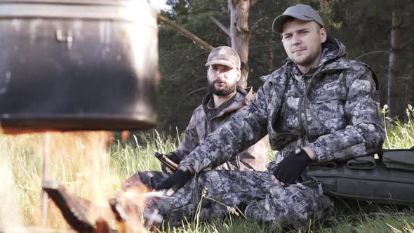 Two Young Man Hunters Near Forest. Summer Vacation Forest. Friends Sit at Forest Picnic. Best