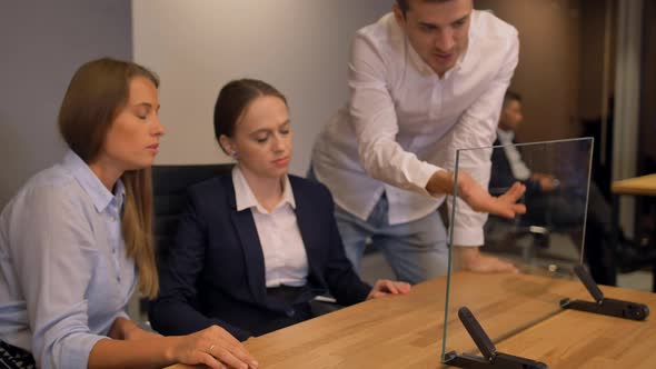 Few Businesspeople Working with Modern Future Transparent Glass Interface Display.